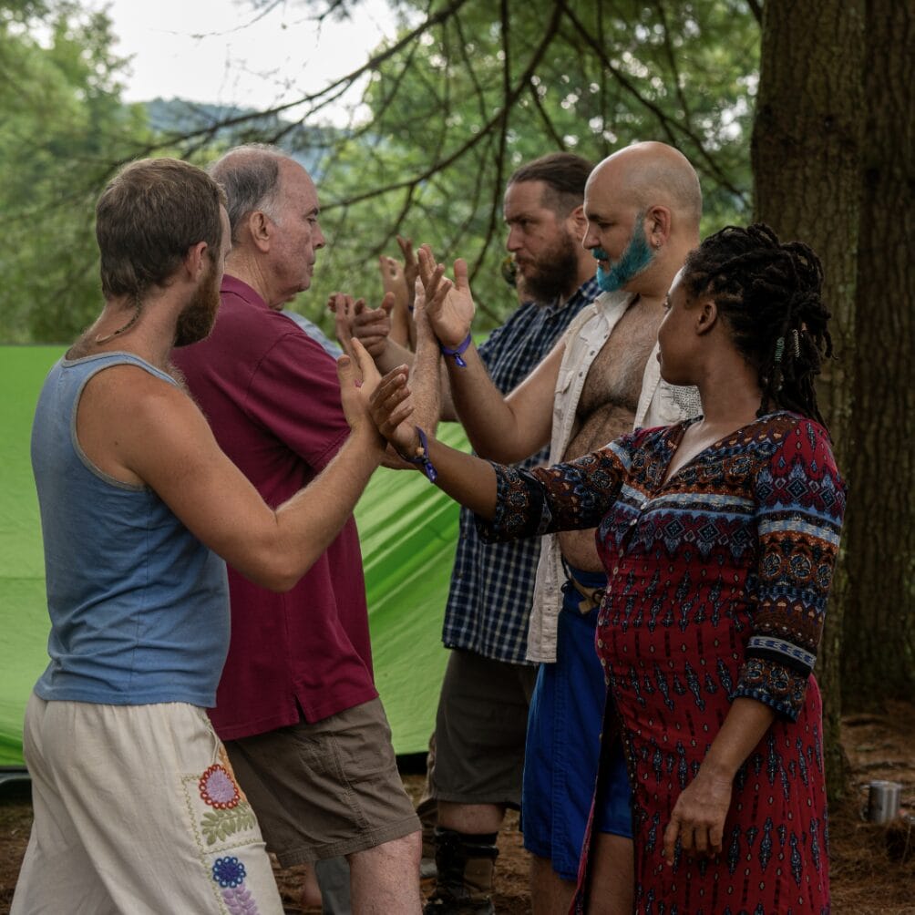 A diverse group of five people at Firefly Gathering are in a